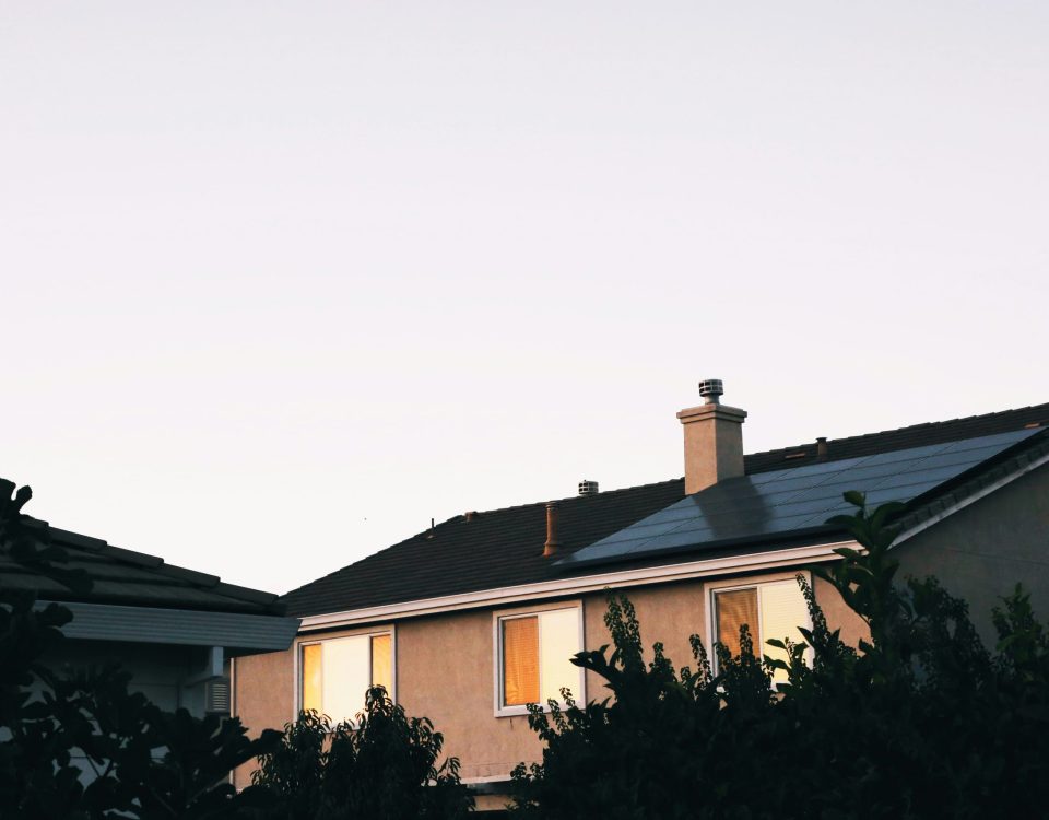 Solar panels on a rooftop of a Canadian home, highlighting their role in reducing average energy consumption and providing financial and environmental benefits.